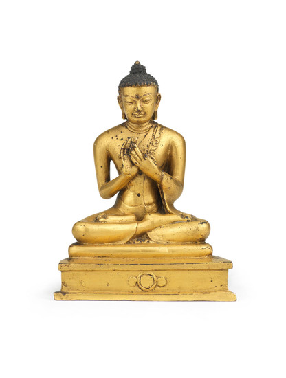 A rare gilt copper-alloy figure of Shakyamuni Buddha