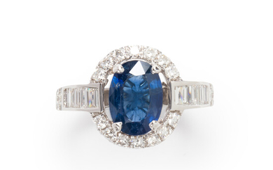 A sapphire, diamond and eighteen karat white gold ring