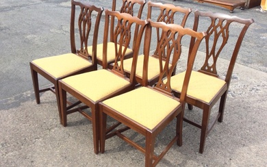 A set of six mahogany Chippendale style dining chairs with...
