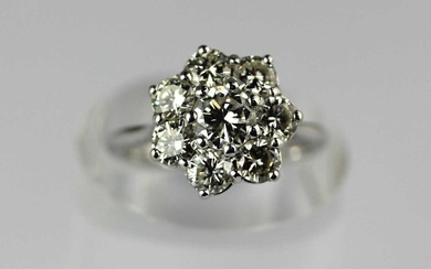 A white gold and diamond eight stone cluster ring