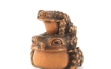 A wood netsuke of two toads