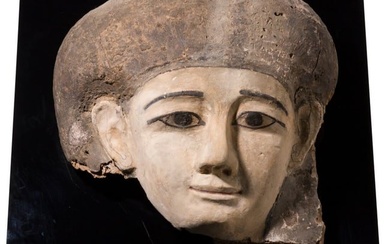 A wooden sarcophagus mask of a woman, Late Period, 664 - 332 B.C.