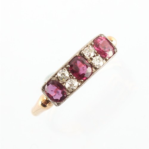 A yellow gold ruby & diamond rectangular panel ring, with th...