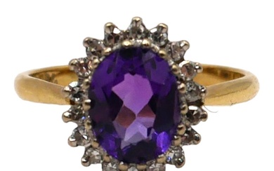 AN 18CT YELLOW GOLD, AMETHYST AND DIAMOND CLUSTER RING...
