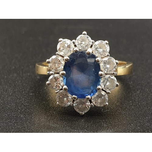 AN 18K DIAMOND AND SAPPHIRE OVAL CLUSTER RING WITH A 2.2CT S...