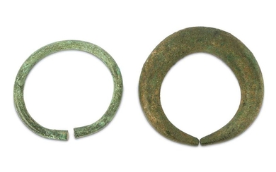 AN ANCIENT BRONZE ANKLET AND A PENANNULAR BRACELET PROPERTY OF THE LATE BRUNO CARUSO (1927 - 2018) COLLECTION Possibly Luristan, Ancient Near East, circa 1st millennium B.C.