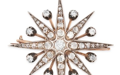 AN ANTIQUE DIAMOND STAR BROOCH / PENDANT in yellow gold and silver, designed as an eight rayed star