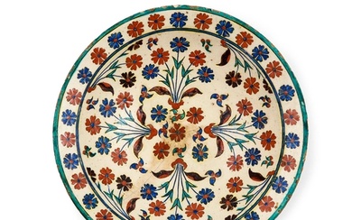 AN IZNIK FLOWER DISH, OTTOMAN, TURKEY, 17TH CENTURY Diamet...