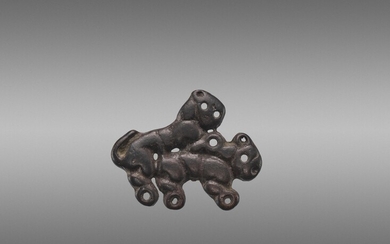AN ORDOS BRONZE ‘COPULATING TIGERS’ PLAQUE, WARRING STATES