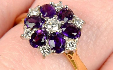An 18ct gold amethyst and brilliant-cut diamond cluster ring.Estimated total diamond weight