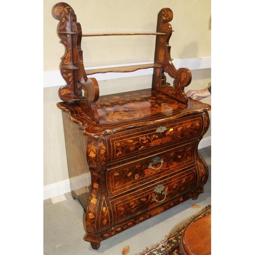 An 18th century Dutch walnut and marquetry bombe commode wit...