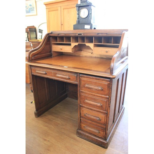 An American mahogany roll top desk, with tambour shutter top...