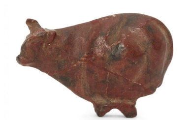 An Egyptian New Kingdom red jasper trussed ox amulet, 18th...