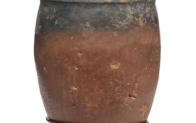 An Egyptian black-topped pottery jar