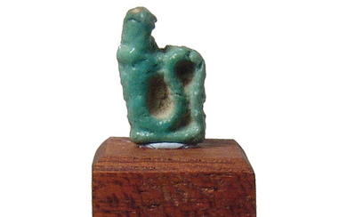 An Egyptian faience amulet of a cobra, Late Period