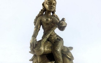 An Indian cast brass figure of a female