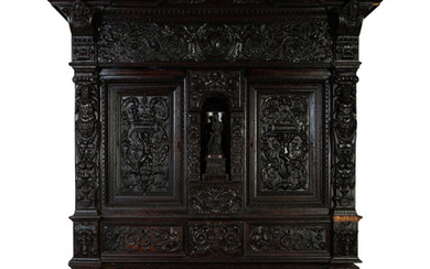 An Italian Baroque Style Carved Oak Cabinet on Stand