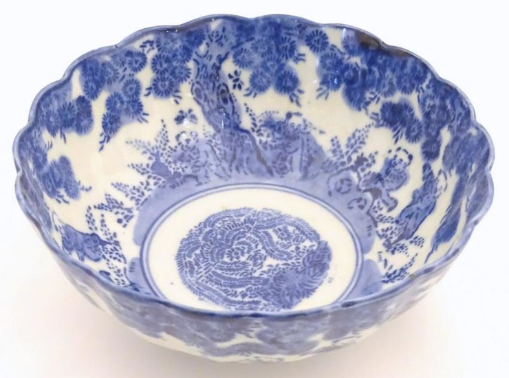 An Oriental bowl with a lobed rim, decorated with