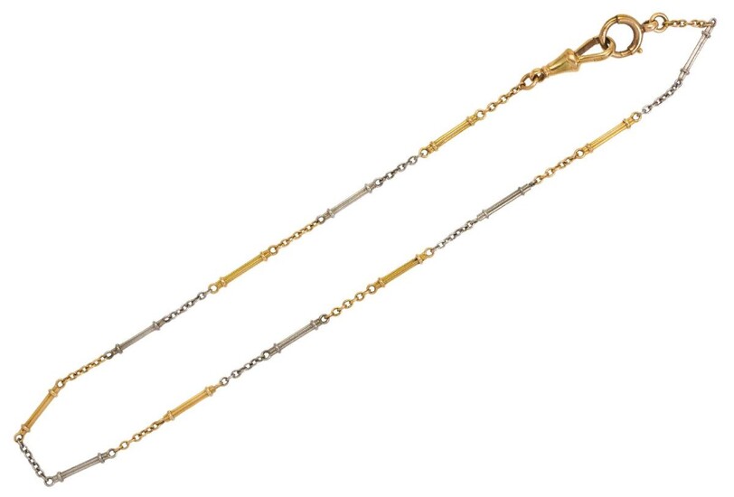 An early 20th century gold and platinum watch chain, of reeded baton and curb link design, stamped 18ct and PT, length 35cm, approximate gross weight 10g, c.1920