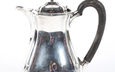 An early 20th century silver lidded hot water jug of waisted form