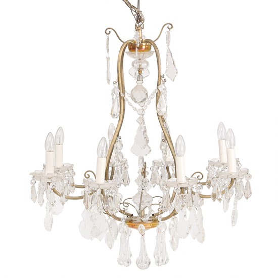 An eight-light crystal chandelier with bronze frame. Electrical. Ca. 1920. H. 100 cm. Diam. 80 cm.