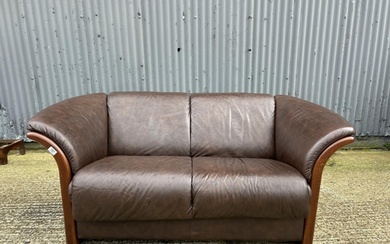 An ekornes brown leather two seater sofa