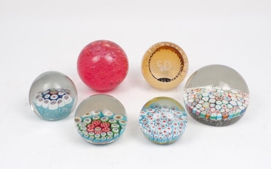 An extensive selection of paperweights to include: a Caithness (Scotland)...