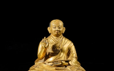 An inscribed gilt-copper alloy figure of the Fifth Dalai Lama, Tibet, 17th century