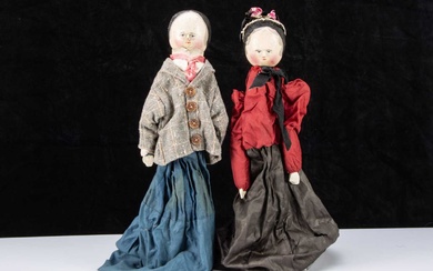 An unusal late 19th century German pegged wooden type hand puppet couple