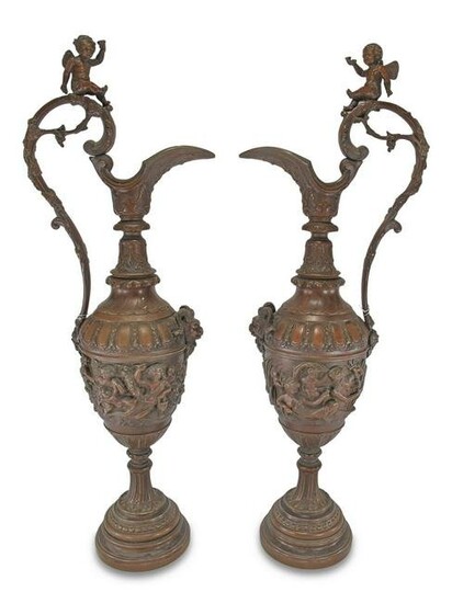 Antique French pair of patinated bronze pitchers
