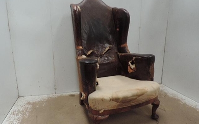 Antique Original Worn Leather Upholstered Wing Armchair on Short...