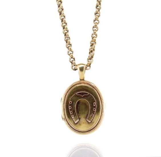 Antique yellow gold horse shoe locket and chain with applied...
