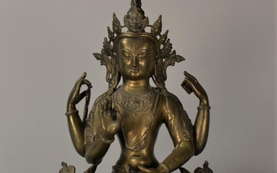 Bouddha en bronze assise sur un socle lotus...