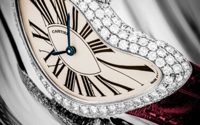 CARTIER. A VERY RARE 18K WHITE GOLD AND DIAMOND-SET LIMITED EDITION ASYMMETRICAL WRISTWATCH