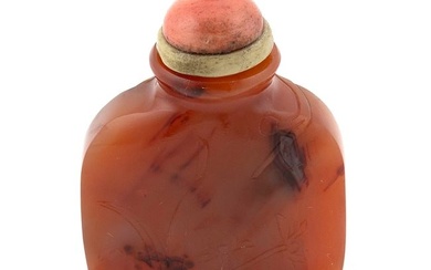 CHINESE CARVED SHADOW AGATE SNUFF BOTTLE Late 19th/Early 20th Century Height 2.5". Coral stopper.