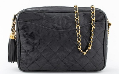 Chanel black lizard skin camera handbag with gold-tone metal hardware to tassel, zipper, and chain