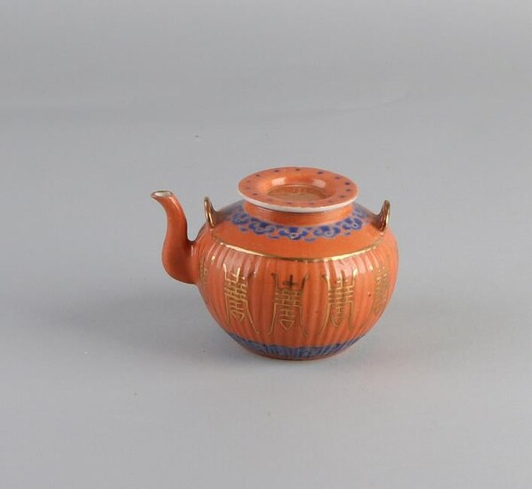 Chinese porcelain teapot with orange glaze and gold