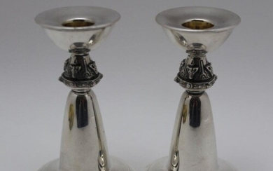 DAVID LAWRENCE, A PAIR OF ARTS & CRAFTS DESIGN SILVER CANDLE...
