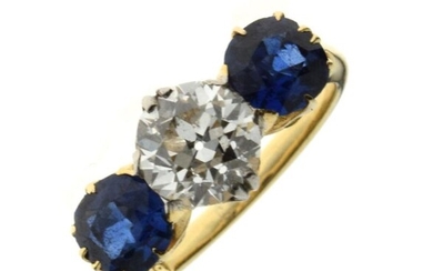 Diamond and sapphire three stone ring, the yellow mount...