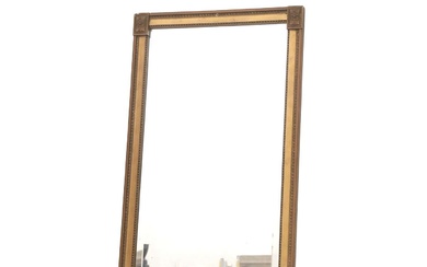 Een facet geslepen spiegel in goud beschilderde lijst. Stijl Empire, 20e eeuw.