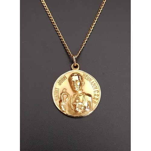 FOURTEEN CARAT GOLD RELIGIOUS PENDANT with relief decoration...