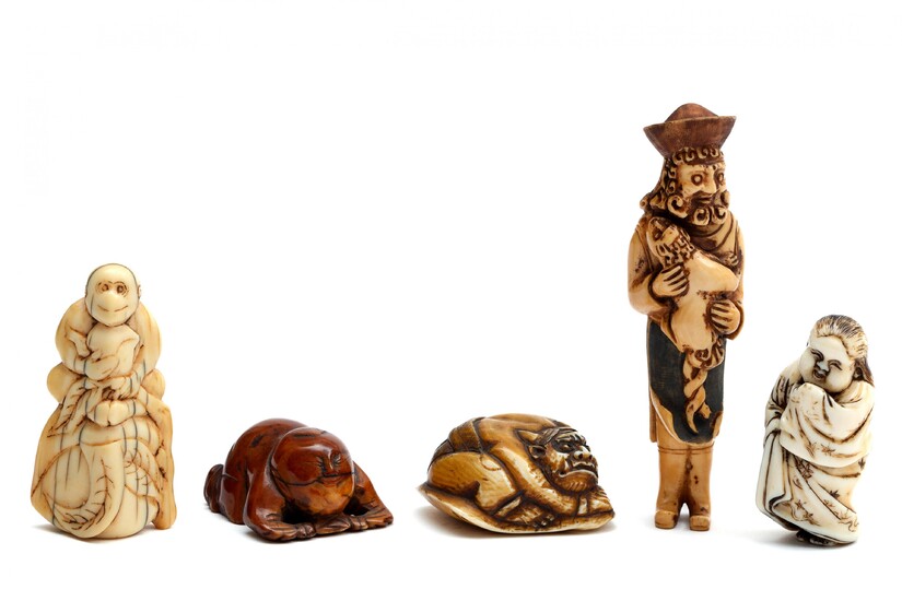Four ivory carved Japanese netsuke and one Chinese toggle