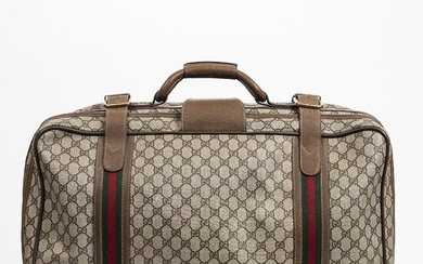 SOLD. Gucci: A travel bag of brown monogram canvas, leather trimmings, gold tone hardware and one handle. – Bruun Rasmussen Auctioneers of Fine Art