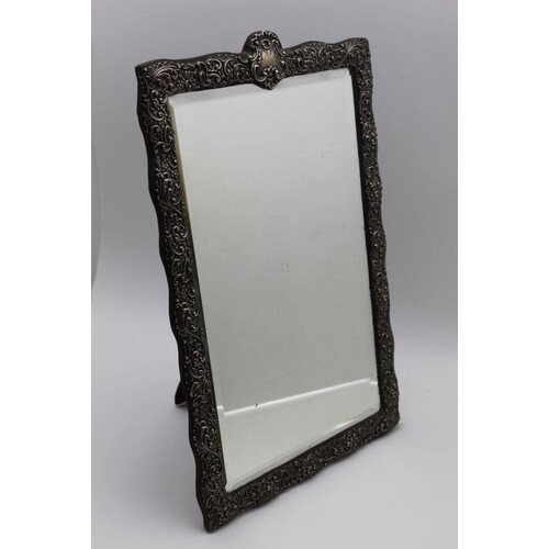 Henry Matthews, a late Victorian embossed silver framed dres...