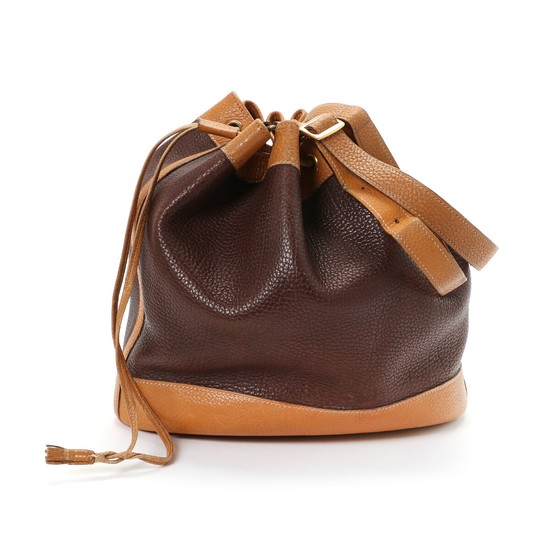 Hermès: A “market” bag made of light brown and dark brown calf leather, adjustable strap, golden hardware and one large compartment.