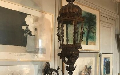 Large wrought-iron lantern with putti decoration and scrolls...
