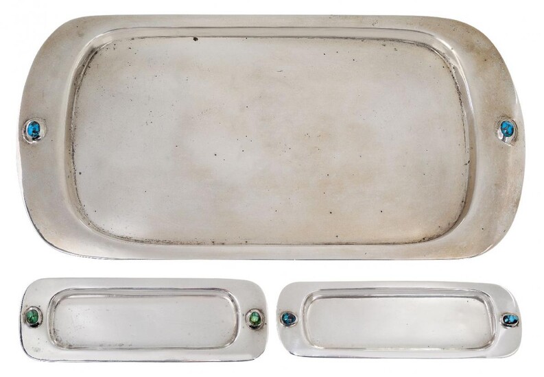 Liberty & Co, a silver tray and two pin trays...