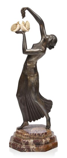 Lucille Sevin (French, born pre 1920- died c.1940), 'Young woman with doves', an Art Deco silvered and patinated bronze and carved ivory figure, c.1930, signed 'Sevin' in the bronze, 'Etling Paris' engraved on the base, Cast by Etling from a model...