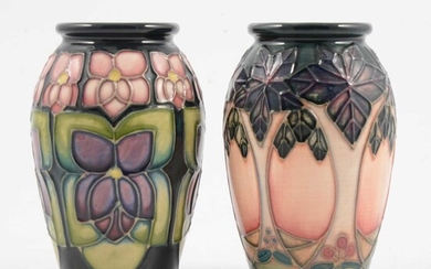 Moorcroft Pottery, 'Cluny' and 'Violets' vases, designed by Sally Tuffin, 1993.