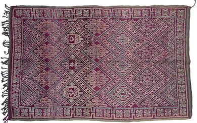 Moroccan Carpet, 2nd quarter 20th century The aubergine diamond lattice...